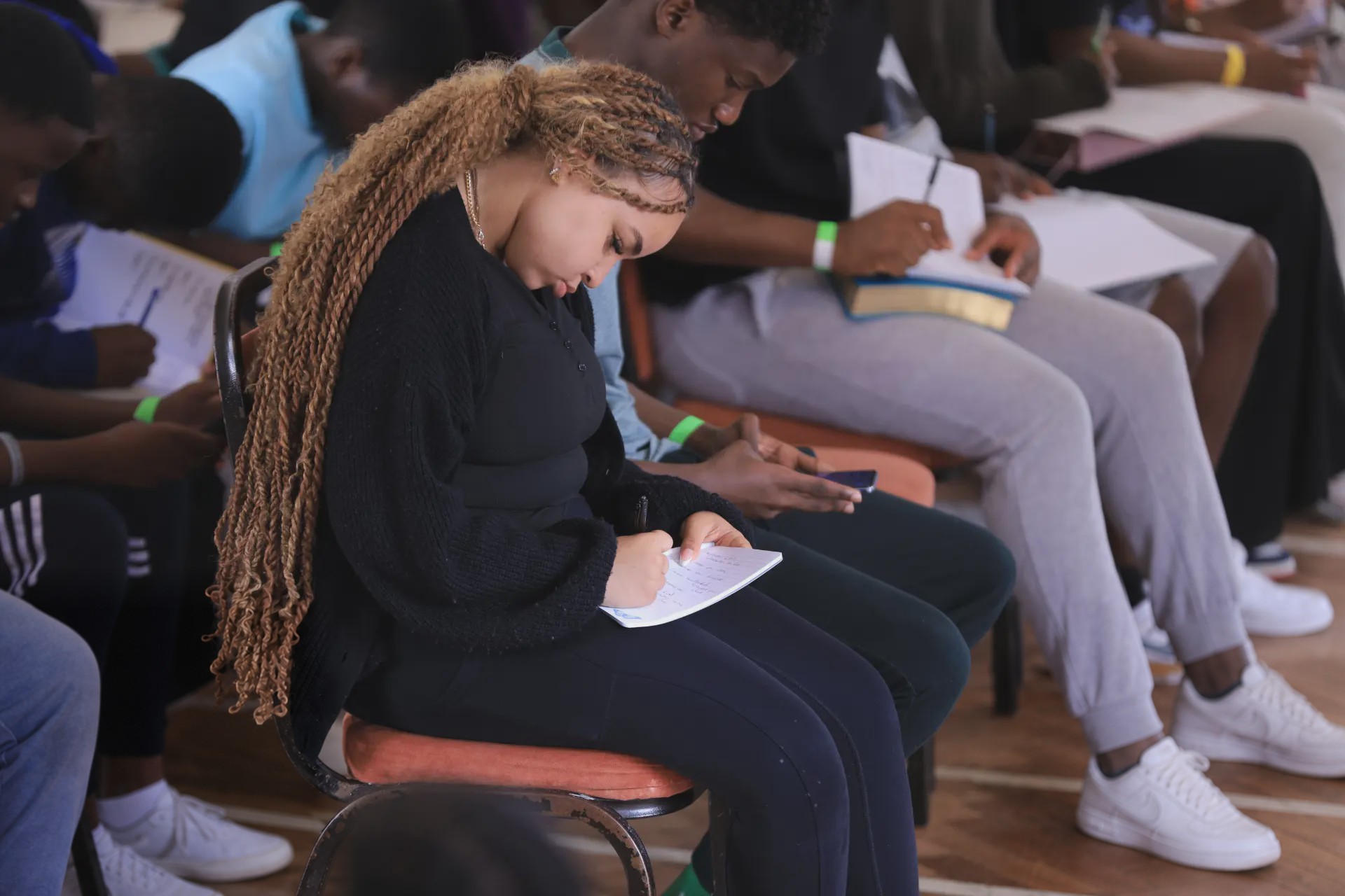 Young people writing during a group workshop