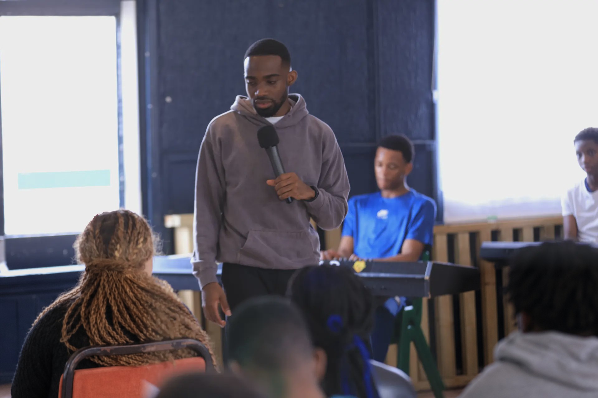 A speaker leading a session for young people